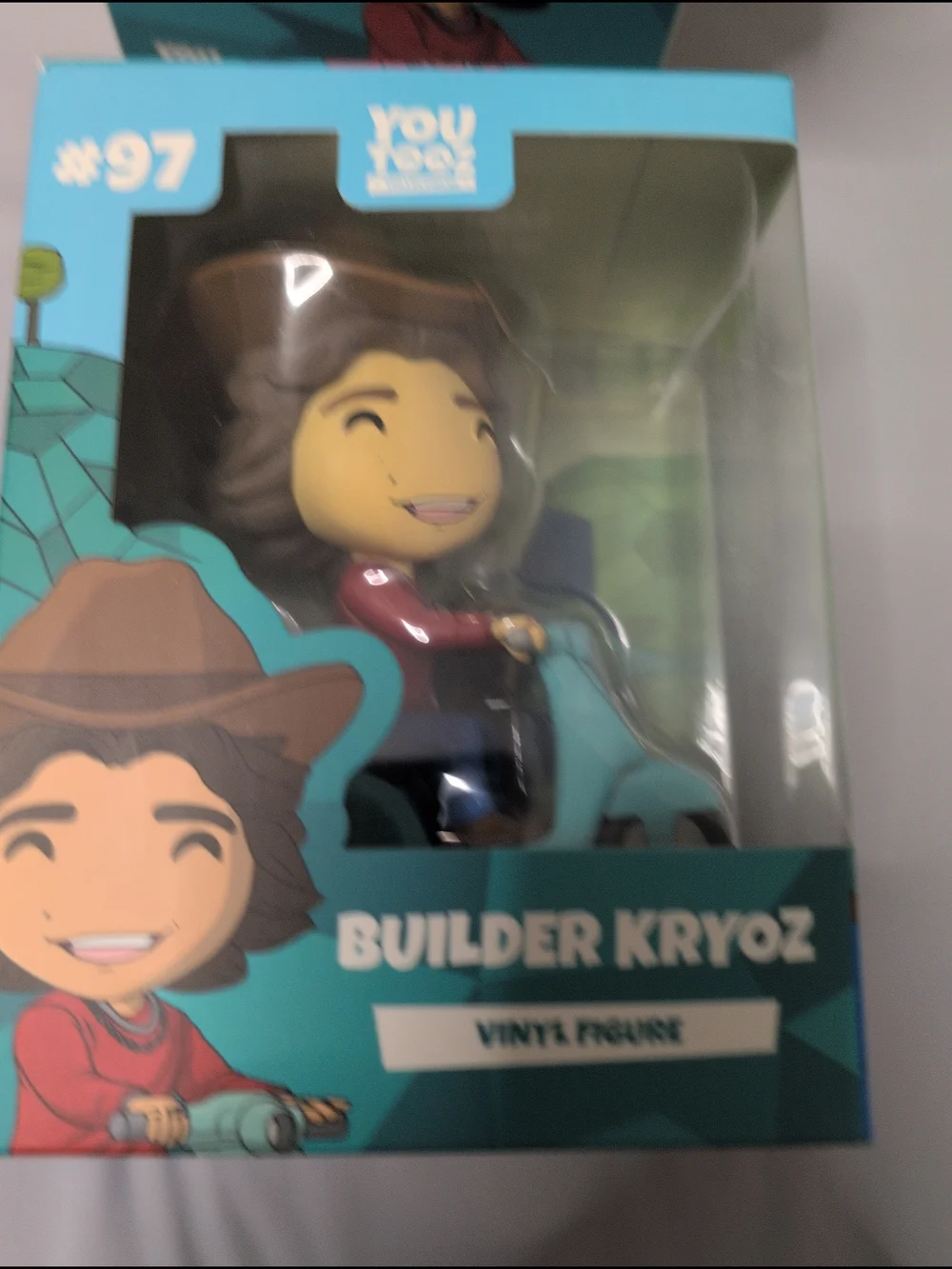 Builder Kryoz Vinyl Figure - Teal and Brown Collectible Toy
